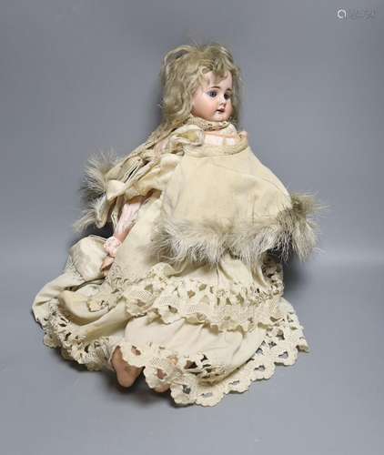 A late 19th century German bisque head doll, impressed mark ...