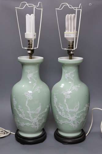 A pair of Chinese slip decorated celadon ground lamps,40cms ...