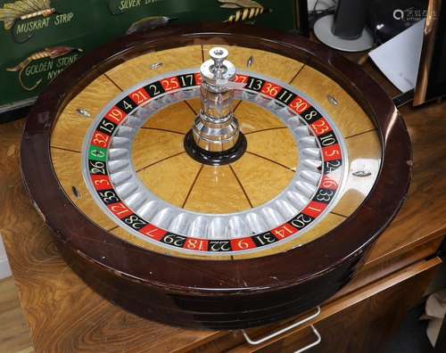 A wood and chrome Technical Casino Supplies roulette wheel, ...