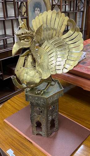 A large Indonesian brass Garuda figural oil lamp and a Islam...