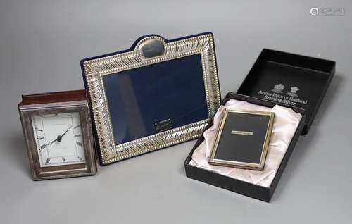 Two modern silver mounted photograph frames and a similar si...