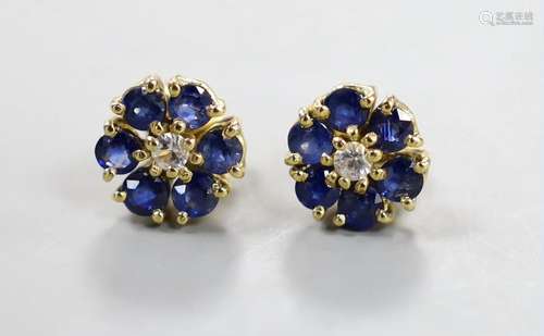 A pair of yellow metal, sapphire and diamond set flower head...