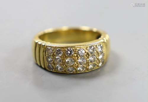 A yellow metal and eighteen stone pave set diamond ring, siz...