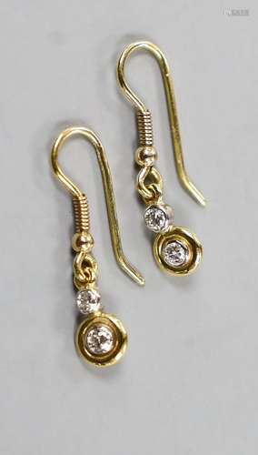 A pair of yellow metal and two stone diamond set drop earrin...