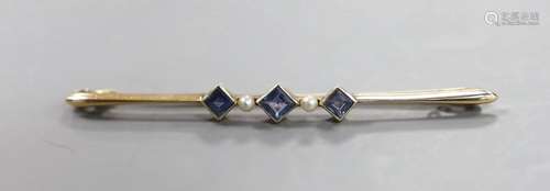 An Edwardian 15ct, three stone sapphire and two stone seed p...