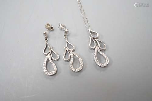 A modern white metal and diamond set quadruple teardrop shap...