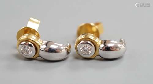 A modern pair of two colour 750 metal and single stone diamo...