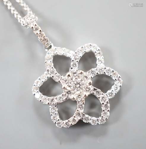 A modern 750 white metal and diamond chip set openwork flowe...