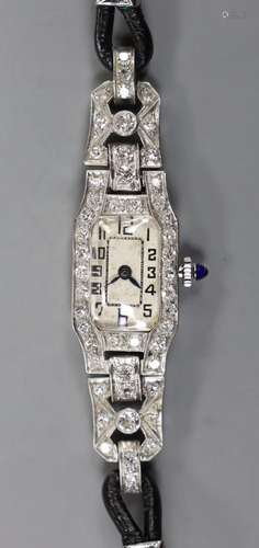 A ladys 1940s white metal (stamped plat) and diamond set man...