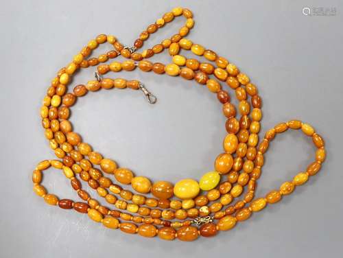 Three assorted amber bead necklaces, longest 112cm, gross we...