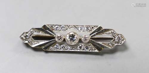 An Art Deco 18ct, plat and diamond cluster shaped bar brooch...