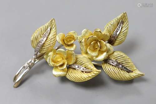 A 1960s two colour 18ct gold and diamond chip set floral spr...