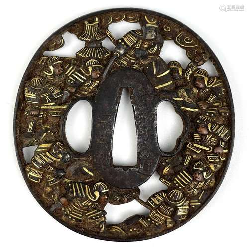 A Japanese iron and gold decorated tsuba, Edo Period.