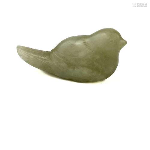 A Chinese pale jade and russet carved bird, Qing Dynasty.