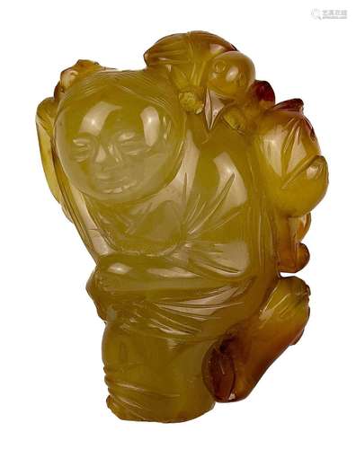 A Chinese jade and russet carving of a boy, Qing Dynasty.