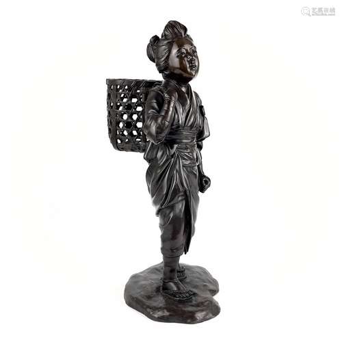 A Japanese bronze figure of a girl carrying a basket. Meiji ...