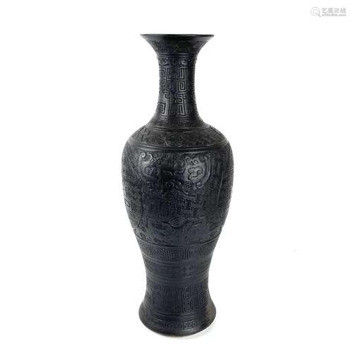 A large rare Chinese carved black porcelain vase, Qing Dynas...