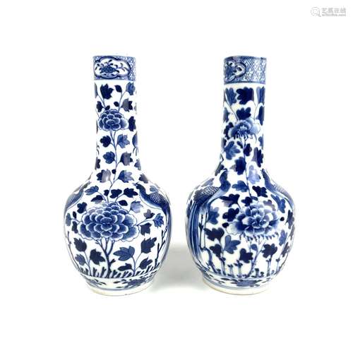 A pair of Chinese blue and white porcelain bottle vases, lat...