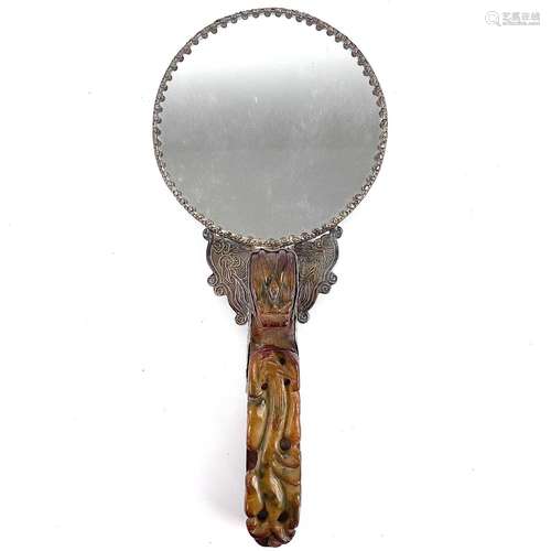 A Chinese white metal jade-mounted mirror.