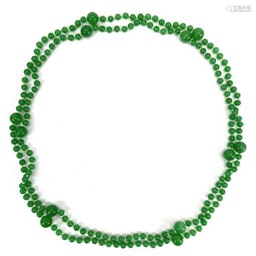 A string of graduating apple jade beads.