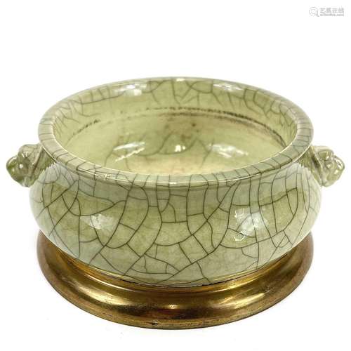 A Chinese porcelain celadon crackle glaze censer with brass ...