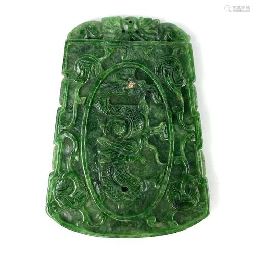 A Chinese spinach green jade type stone pendant.