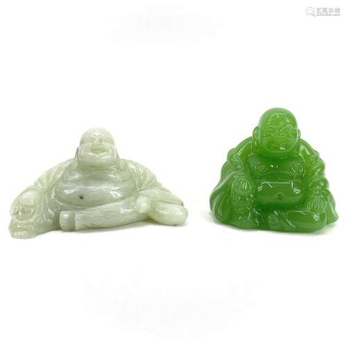 A Chinese carved jade figure of a seated laughing buddha.