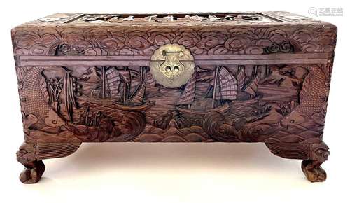 A Chinese carved camphor wood chest, 20th century.