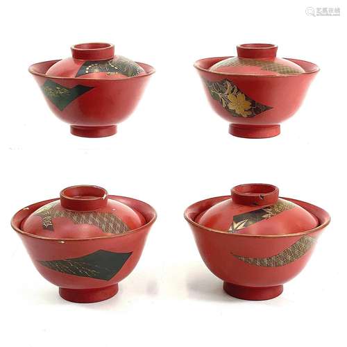 A set of four Japanese ceramic and lacquer bowls and cover.