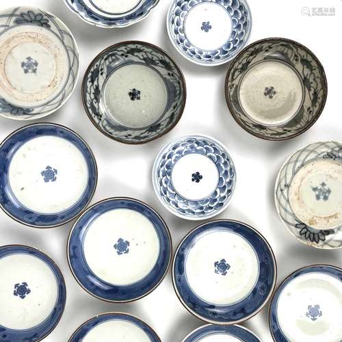 Fourteen Japanese Nabeshima blue and white porcelain dishes,...