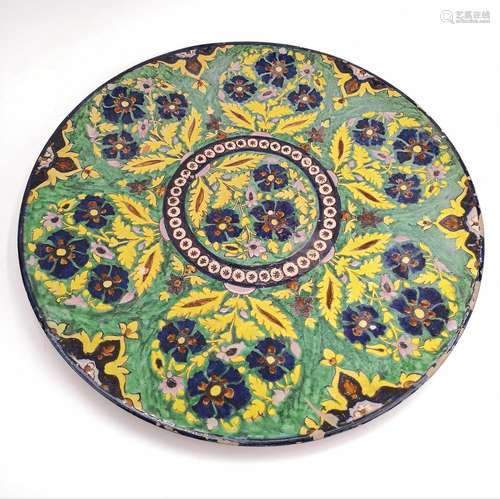 A large Persian pottery charger, circa 1900.