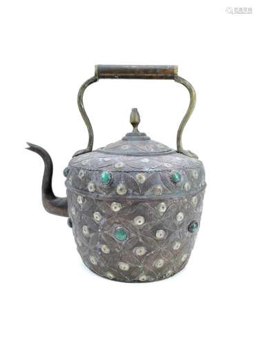 An Indian copper kettle with applied semi precious stones.