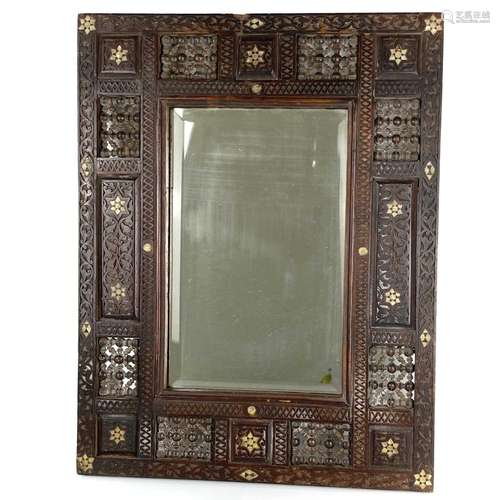 A Syrian hardwood wall mirror, 19th century.