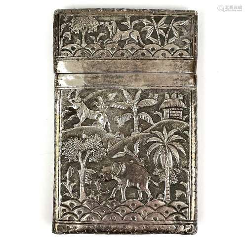 An Burmese silver card case, decorated with trees and animal...