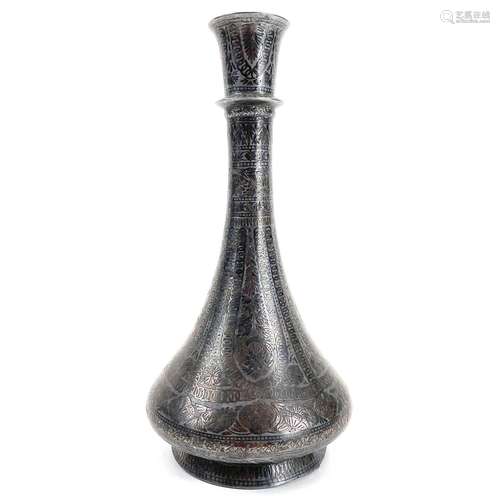 A 19th century Persian white metal damascened bottle vase.