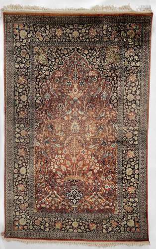 An Indian silk rug.