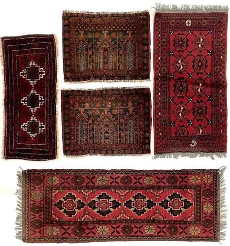 Two Afghan rugs.