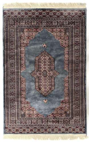 A Pakistan rug, signed,