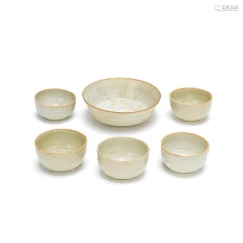 A GROUP OF FIVE PALE CELADON CUPS AND A BOWL Song/Yuan Dynas...