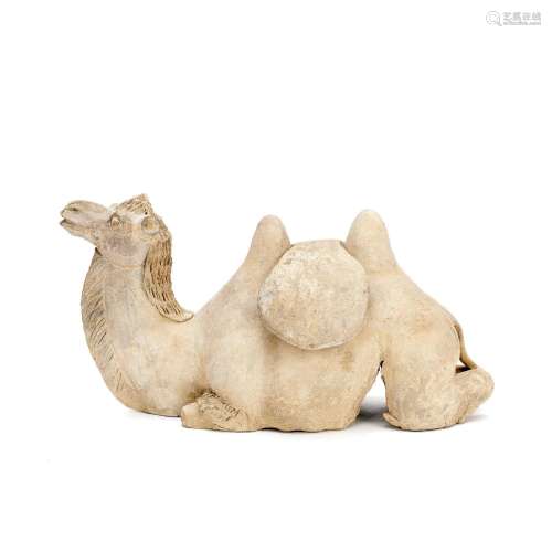 A POTTERY MODEL OF A RECUMBENT CAMEL Northern Qi or Tang Dyn...