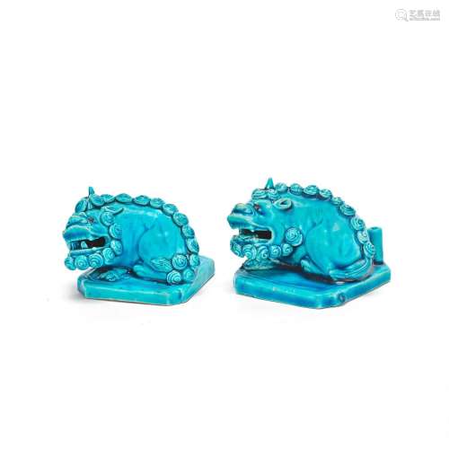 A PAIR OF UNUSUAL TURQUOISE GLAZED 'BUDDHIST LION' J...