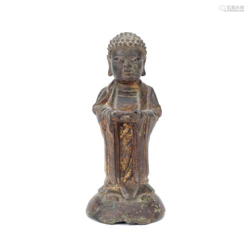 A LACQUERED GILT BRONZE STANDING BUDDHA 17th century
