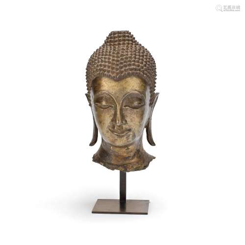 A LARGE GILT BRONZE HEAD OF BUDDHA Thailand, 20th century