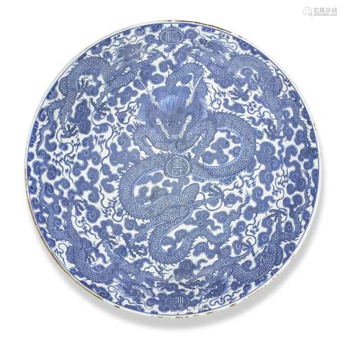 A large blue and white 'dragon' dish, Qing dynasty, ...