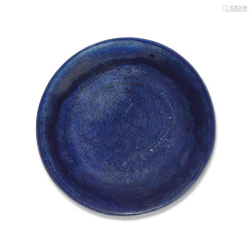 An incised blue-glazed 'phoenix' dish, Mark and peri...