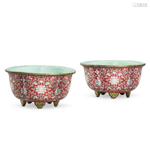 A pair of ruby-ground famille-rose jardinières, Qing dynasty...