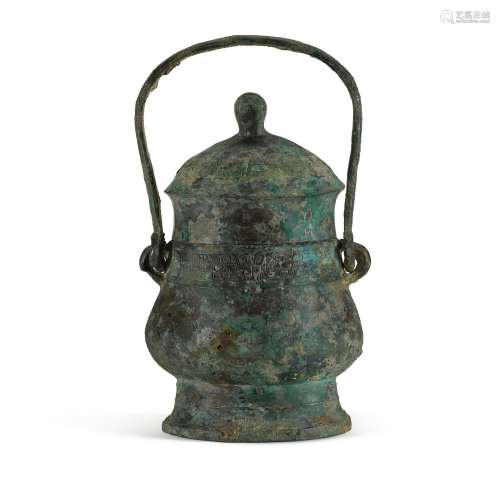 An archaic bronze ritual wine vessel and cover, You, Western...