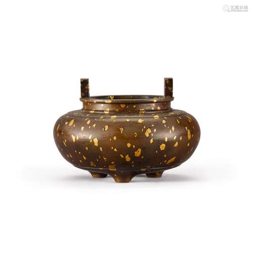 A gilt-splashed bronze tripod censer, Qing dynasty, 18th cen...