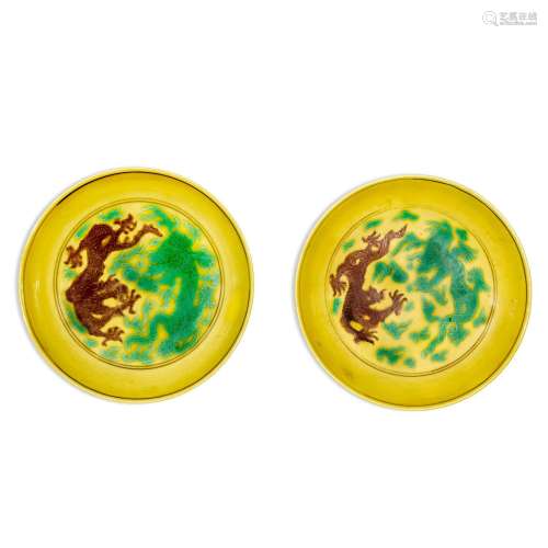 A pair of yellow-ground green and aubergine-enamelled 'd...