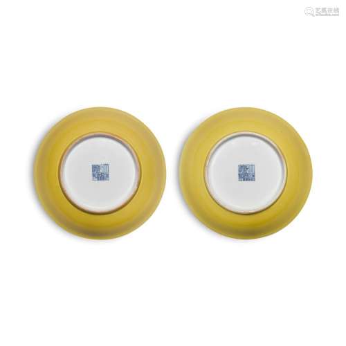 A pair of yellow-glazed dishes, Seal Marks and period of Qia...